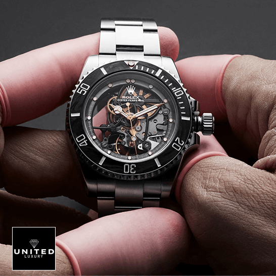 rolex_oyster_perpetual_skeleton_dial_steel_114200_front_hand- rolex_oyster_perpetual_skeleton_dial_steel_114200_front_hand-